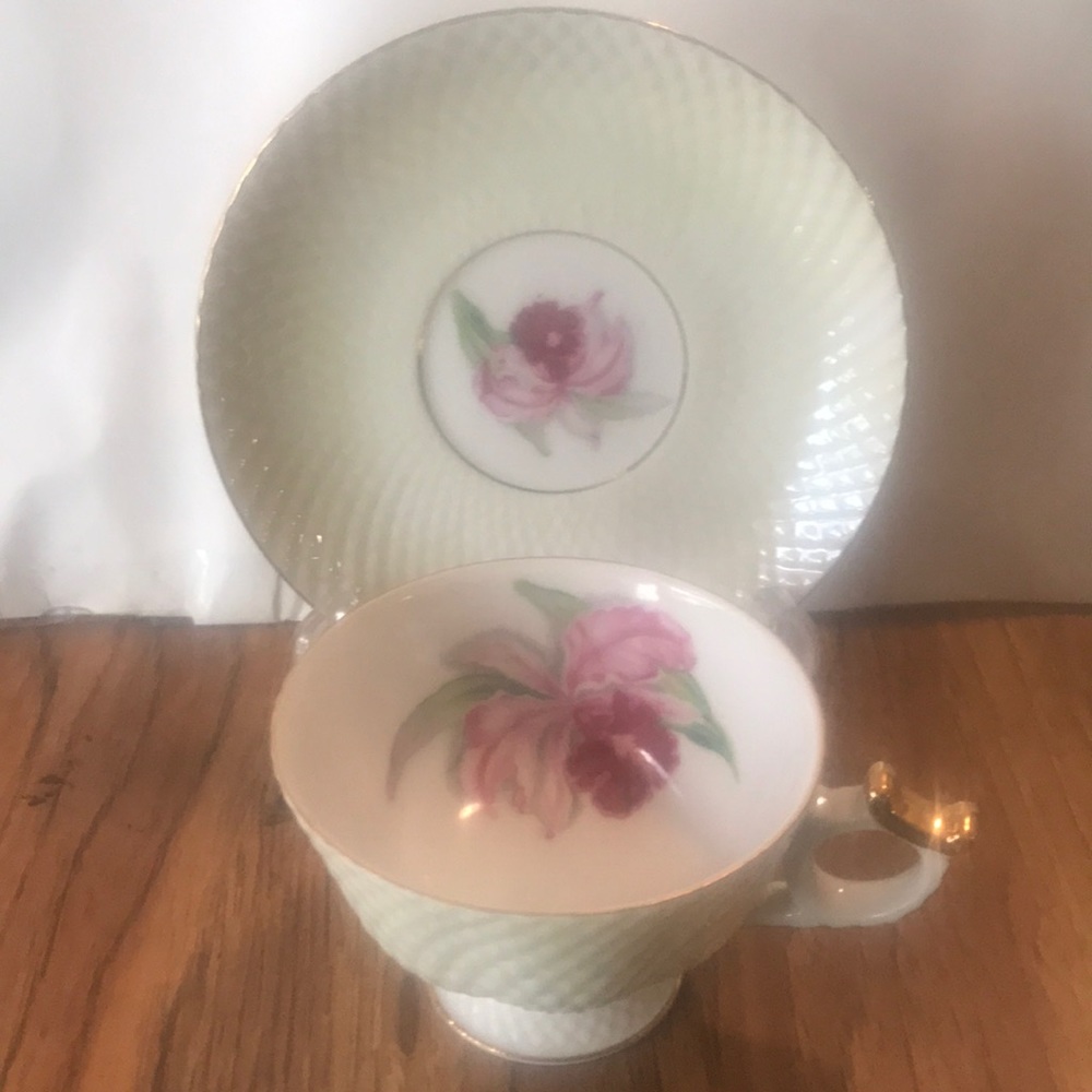 Vintage mother of pearlish , abit opalescent 2 pc China cup n saucer.  Gold trim